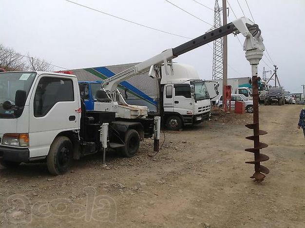 Ямобур Isuzu ELF ( услуги по бурению БКМ)
