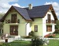 Двухэтажный кирпичный дом в стиле кантри оригинальной формы.